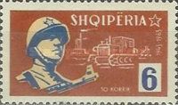 Soldier with gun, industrial plant, bulldozer