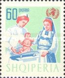 Albanian mother and nurse weighing infant