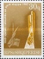‭Gun, quill pen, book of the alphabet and monument