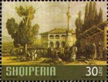 Crowd in front of Building with a Minaret