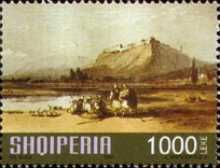 Castle on mountain, people near river
