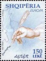 Hand holding quill pen, map of Albania and Adriatic region