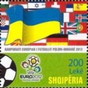 Emblem, football, European flags and large flag of Ukraine