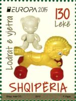 Horse with wheels and teddy bear made of plastic