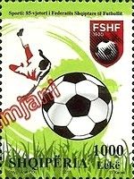 Federation emblem, football and player making scissor kick