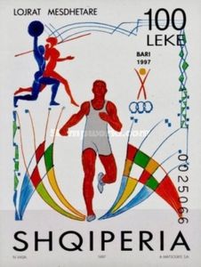 ‭Man breaking finish line, silhouettes of man and woman
