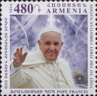 Pope Francis (with right hand raised)