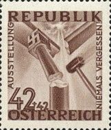 Hammer crushing a pillar with swastika capital