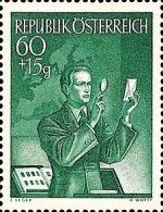Collector examining a stamp