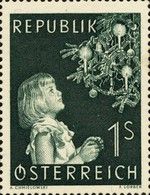 Girl with decorated christmas tree