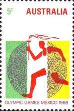 Runner with Olympic Torch in front of Aztec Calendar