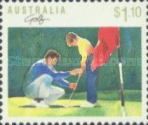 Golf - Father teaching son to putt