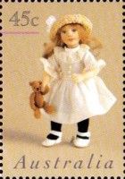 Doll Wearing White Dress with Teddy Bear