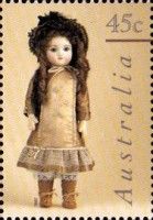 Doll in Brown Dress and Bonnet