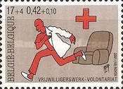 Red Cross Volunteer on his Way to the Mission