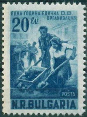 Man and woman with wheelbarrow and spade