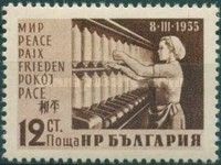 Female Textile Worker before Spinning Machine