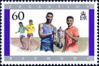 Boys holding sports trophy