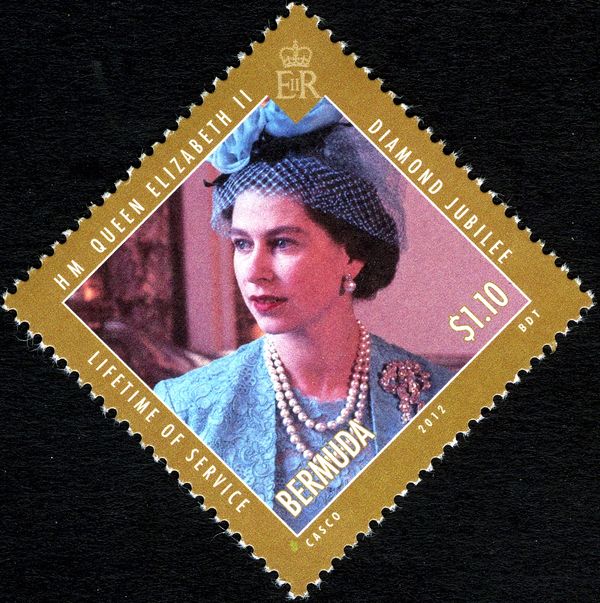 An official Coronation portrait of Queen in blue outfit