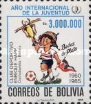 Child clutching trophy and flag