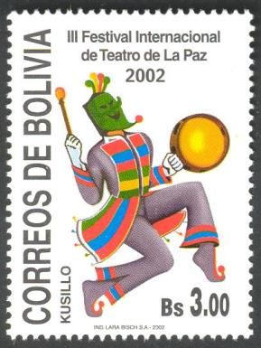 Masked Dancer with drum.