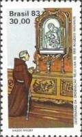 Father Rogerio Neuhaus Kneeling at the Altar