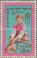Boy filling grain box