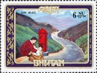 Letter carrier at mail box