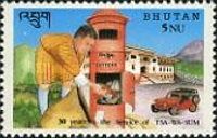 Letter carrier emptying a mail box