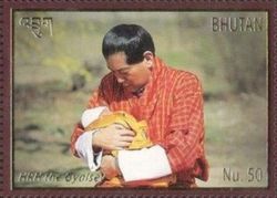 HRH the Gyalsey (King Jigme holding son)