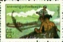 Soldier behind man in boat