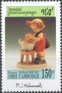 Girl bathing doll