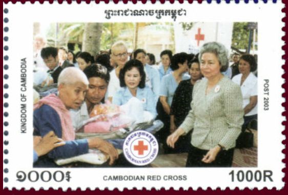 Queen and Prime Minister’s wife giving items to people