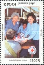 Queen and Prime Minister’s wife giving items to people