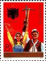 Woman and man holding pick and rifle