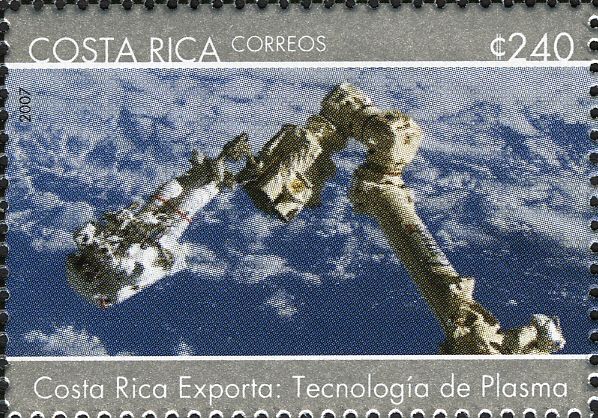 Astronaut and Spacecraft’s Robot Arm