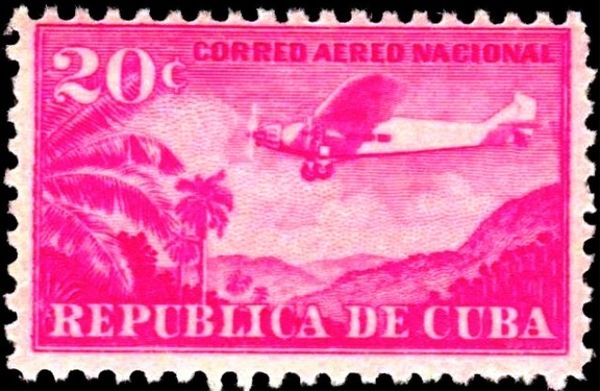 Plane Ford 4-AT Tri-Motor over mountain landscape