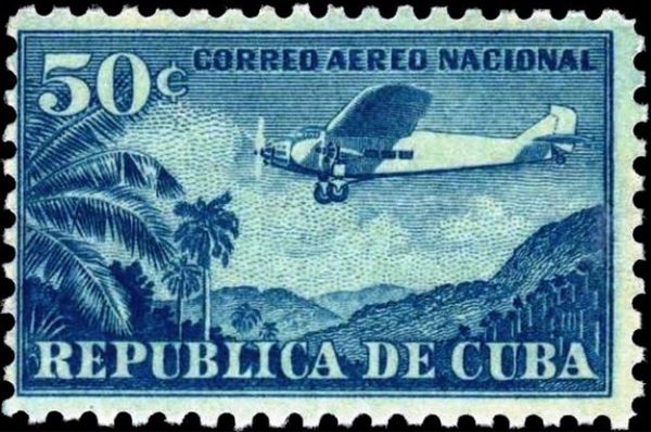 Plane Ford 4-AT Tri-Motor over mountain landscape