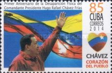 Hugo Chavez with arm raised