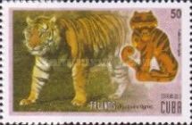 Tiger (Panthera tigris) and carving of tiger