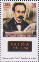 Martí reading Patria newspaper, plaque from Patria building