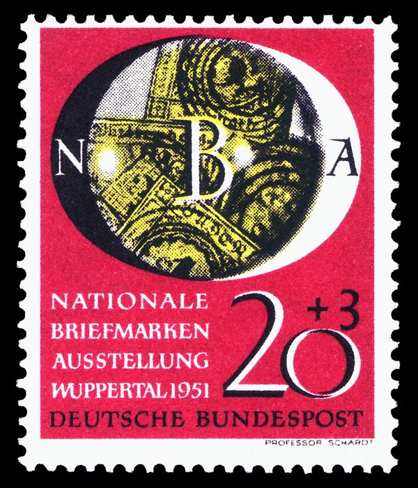 Old German stamps under a magnifying glass