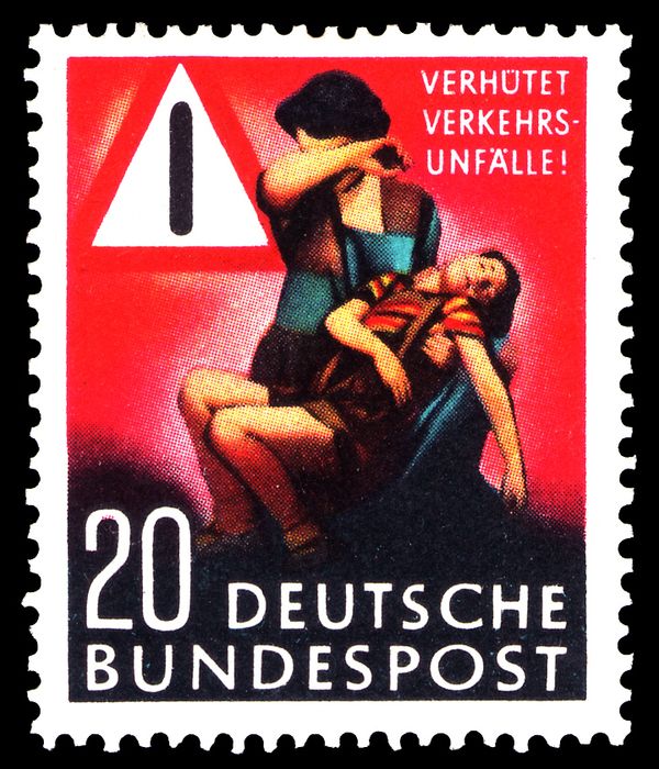 Mother with injured boy, traffic sign