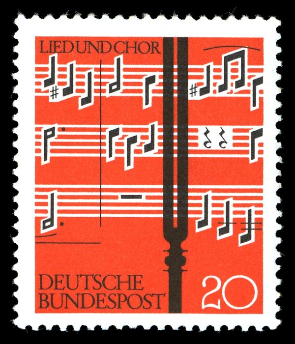 Tuning fork in front of musical notation