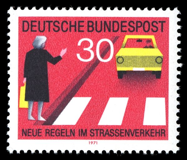 Give priority to pedestrians at crosswalk, give hand signal