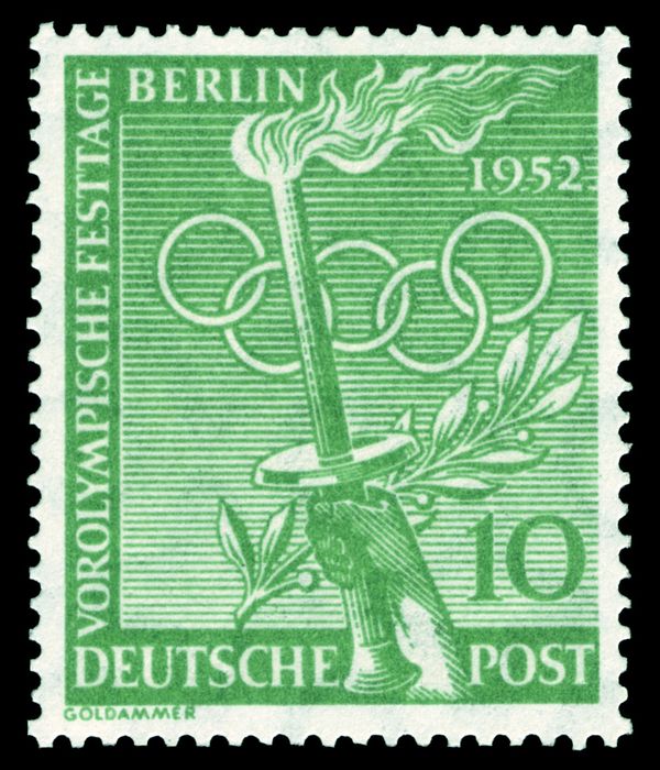 Torch, laurel wreath, Olympic rings
