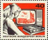Girl in front of TV and video cassette recorder