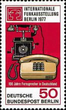 Telephone from 1905 and desk phone from 1977, exhibition log