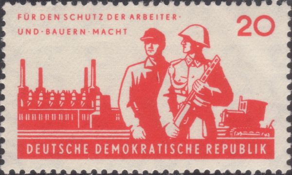 Soldier and worker, industrial plant, tractor