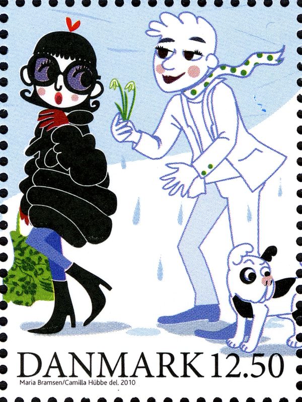 Man with dogs presents flowers to woman